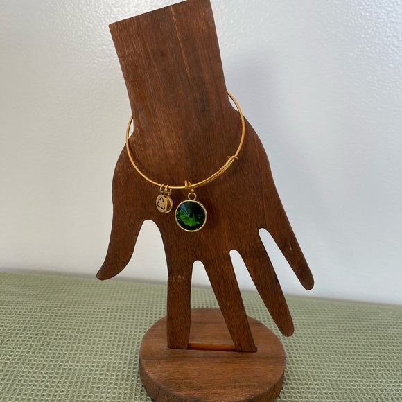 Jewelry - Birthstone bangle bracelet in gold toned setting - emerald colored stone